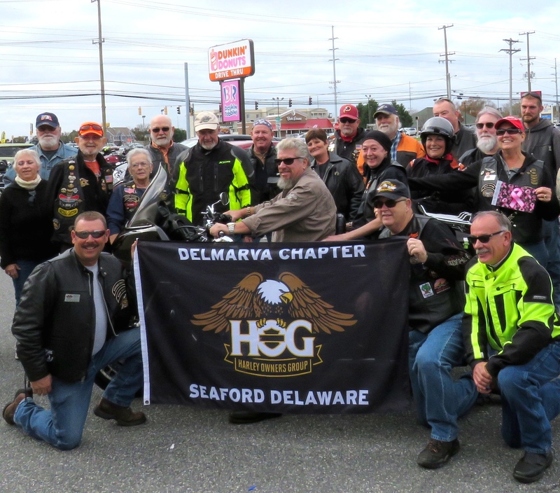 Members of the Seaford-based Delmarva HOG chapter who rallied for Dianne Shamy on a bucket list ride to Ocean City included (front, l-r) Marty Brock, Ron Horner with Dianne Shamy on his motorcycle, Nolan Wilcutts and Gary Niblett. In back are Anne and Donnie Allen, Pat DeCarlo, Yvonne Shanks, Dexter Drake, Road Captain John Pulli, Sandy Ford, Ben Ewing, Dave Smith, Brenda Drake, Rich Taylor and Rebecca Wilcutts, lady of Harley for the Delmarva chapter. BY SUBMITTED